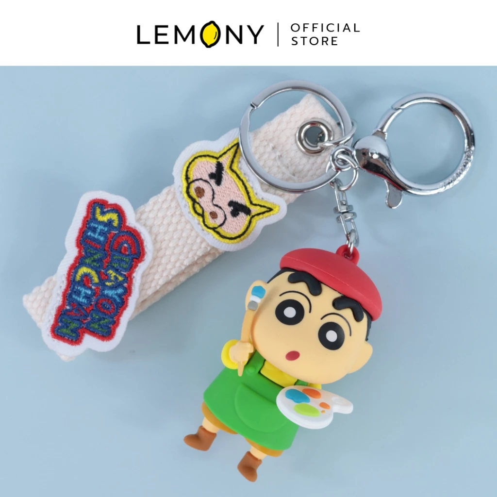 วงกุญแจชินจังคอลเลกชันศิลปินตัวน้อย วางคู่กับสายคล้องผ้าปัก